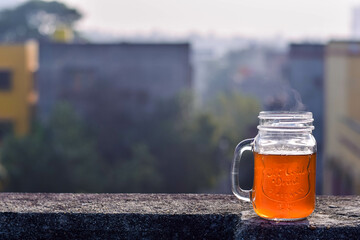 Closeup of a glass mug of morning tea