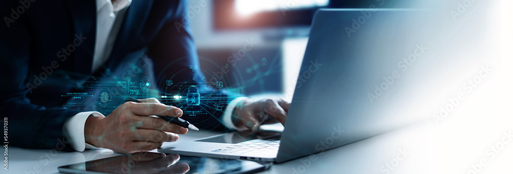 Fototapete .Businessman using laptop and encryption of business data network with fingerprint scanning and Biometric identification of security, Protect business transaction from digital cyber attack.