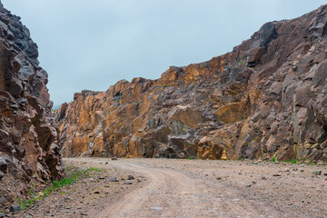 Grader road in the rocks of the tundra of the Kola Peninsula. Russia