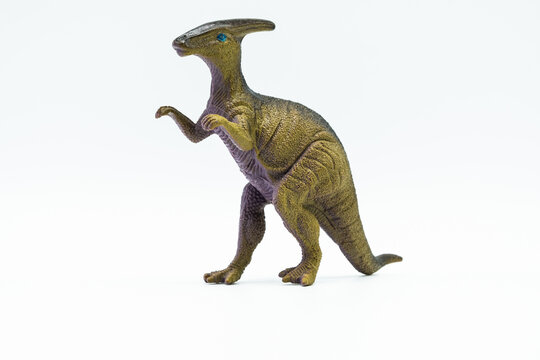 Funny dinosaur toy figure on white background