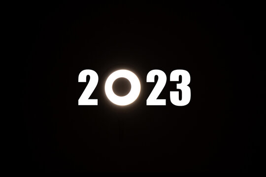 2023 text on a black background where instead of zero the LED lamp is round, Happy new year 2023 on a black