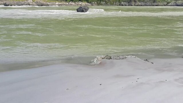 Morning view at GOA beach located in Rishikesh Uttarakhand near Laxman Jhula, Clean view of Ganga river at Rishikesh during early morning time, World famous GANGA river full view