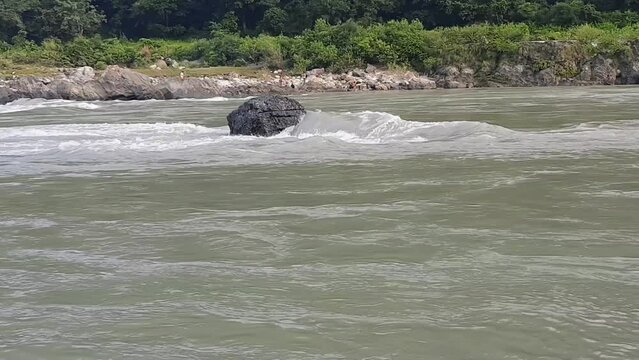 Morning view at GOA beach located in Rishikesh Uttarakhand near Laxman Jhula, Clean view of Ganga river at Rishikesh during early morning time, World famous GANGA river full view