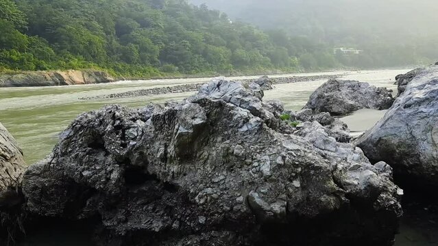 Morning view at GOA beach located in Rishikesh Uttarakhand near Laxman Jhula, Clean view of Ganga river at Rishikesh during early morning time, World famous GANGA river full view