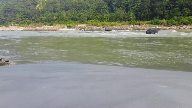 Morning view at GOA beach located in Rishikesh Uttarakhand near Laxman Jhula, Clean view of Ganga river at Rishikesh during early morning time, World famous GANGA river full view