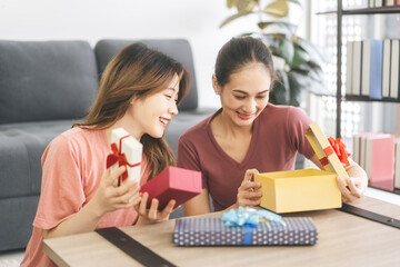 Southeast asian adult people couple give a gift box for anniversary or holidays event