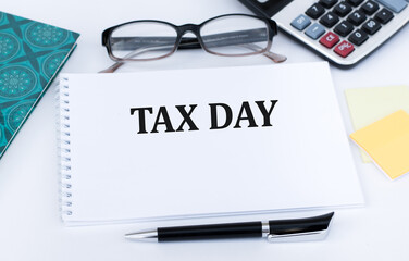 Tax return form and hand written tax day text