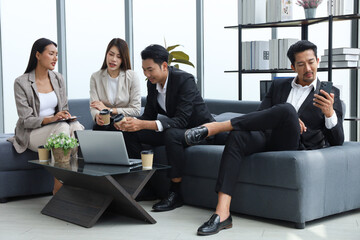 Business people relax meeting in office by using laptop computer and discussion or brainstorming