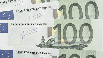 Notes of 100 euros close-up. Light background about economy and finance of European Union. News pale wallpaper about euro. Eurozone currency and ECB. Banking in Europe. Macro