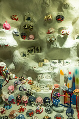 Shop window made of white stone with colorful objects