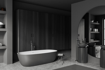 Naklejka na ściany i meble Corner view on dark bathroom interior with bathtub, large mirror