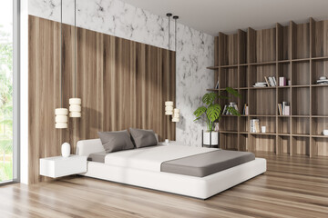 Light bedroom interior with bed and decoration on shelf. Empty wall