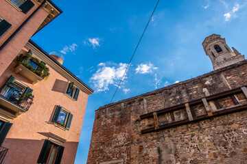 Fototapeta na wymiar Old buildings and brick tower of Verona
