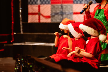 santa's helpers on a stage
