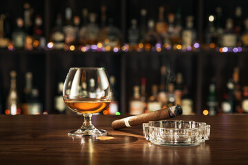 NO LOGOS OR TRADEMARKS!  SELF MADE LABELS! close up view of cigar and glass aside on color back. 