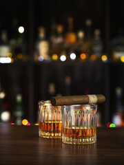 NO LOGOS OR TRADEMARKS!  SELF MADE LABELS! close up view of cigar and glasses on color back. 