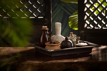 Obraz na płótnie Canvas close up view of herb, bath-salt, oil and Herbal Compress on color back.