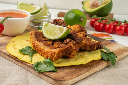 Deep-fried pork belly until crispy and served with tortilla, pepper sauce and vegetables.