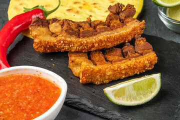 Crispy appetizer of deep-fried pork belly served with pepper sauce.