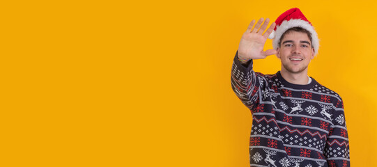 Fototapeta premium isolated young man with christmas clothes