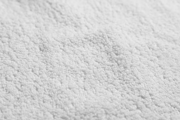 Texture of soft white towel as background, top view