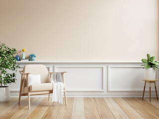 Cream room wall mock up in warm tones with armchair and decoration minimal.