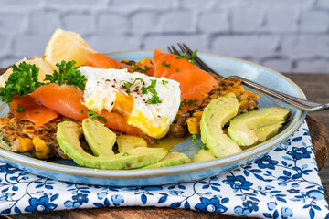Corn and quinoa fritters with smoked salmon and poached egg