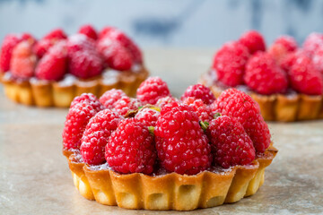 Raspberry and pistachio tarts