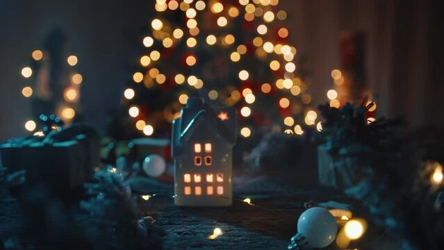 Christmas atmosphere with a little house and Christmas tree as background