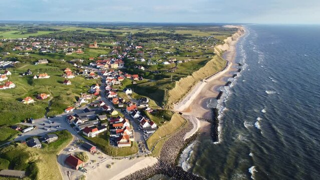 Aerial drone view of the idyllic coast line in Denmark around the village of Lønstrup on a summer day