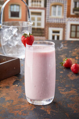 Strawberry Lassi served in glass isolated on table top view of punjabi culture