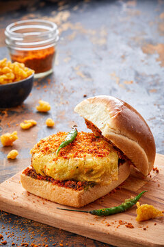Bombay Vada Pav isolated on wooden board side view of indian food
