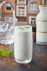 Chaas Masala Lassi with mint served in glass isolated on table top view of punjabi culture