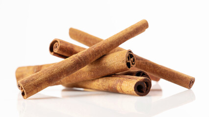 Cinnamon sticks on white background..