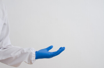 Hand scientist in blue glove.