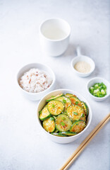 Spicy soy sauce cucumber salad in a bowl