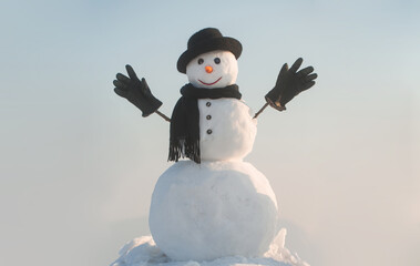 Snowman with open hands. Winter snowman in black hat, scarf and gloves. Christmas winter banner...