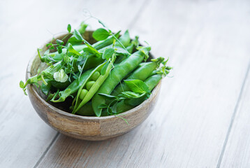 Bowl with sweet pea pods