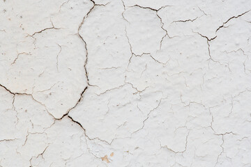 Textura de pared con pintura blanca agrietada
