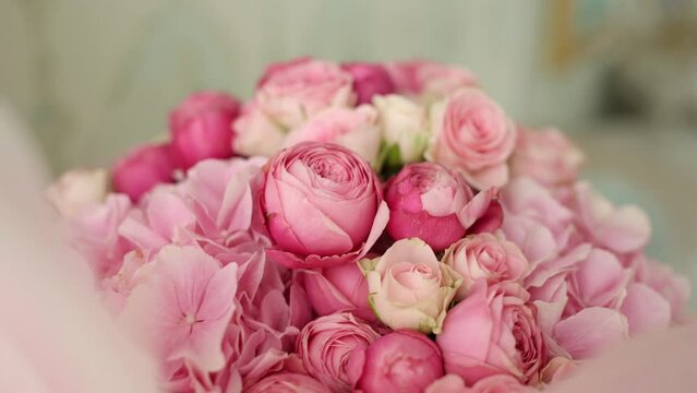 a bouquet of pink roses at a birthday celebration