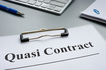 Quasi contract papers, a pen and documents.