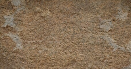 Fondo con detalle y textura de superficie de piedra rugosa en tonos marrones y blancos
