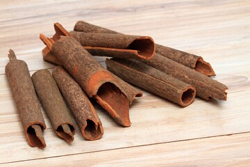 Cinnamon,  Cinnamomum cassia called Chinese cassia. Also Chinese cinnamon, sticks on the wooden table.