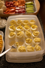 a serving tray of deviled eggs that used to be full