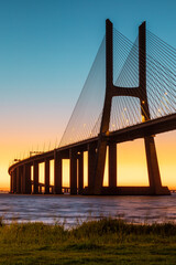 Vasco da Gama bridge at sunrise in a cold November morning: this bridge is simply beautiful, curvy and sexy!