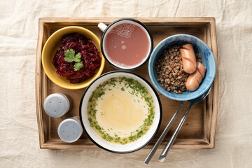 Set lunch in bowls in a wooden serving box. Food and catering concept. Open container for food