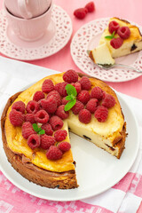 Quark and mascarpone crustless cheesecake served with raspberries