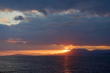 sunset with dramatic cloud sky  at Clifton beach in county Galway, western part of the Republic of Ireland