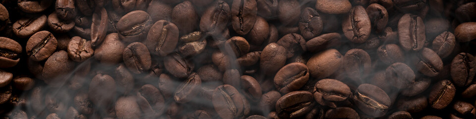Banner 4x1 background with a scattering of coffee beans filling the entire space with smoke