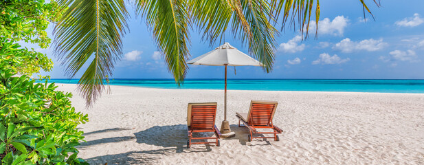 Naklejka na ściany i meble Maldives island beach. Tropical landscape of summer panorama, white sand with palm trees. Leisure couple travel destination. Exotic beach landscape. Inspire happy beach beds umbrella. Love honeymoon